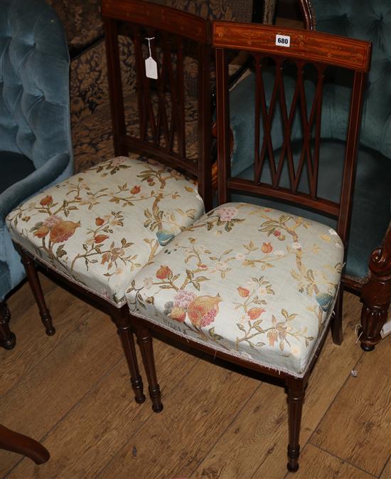 A pair of upholstered bedroom chairs